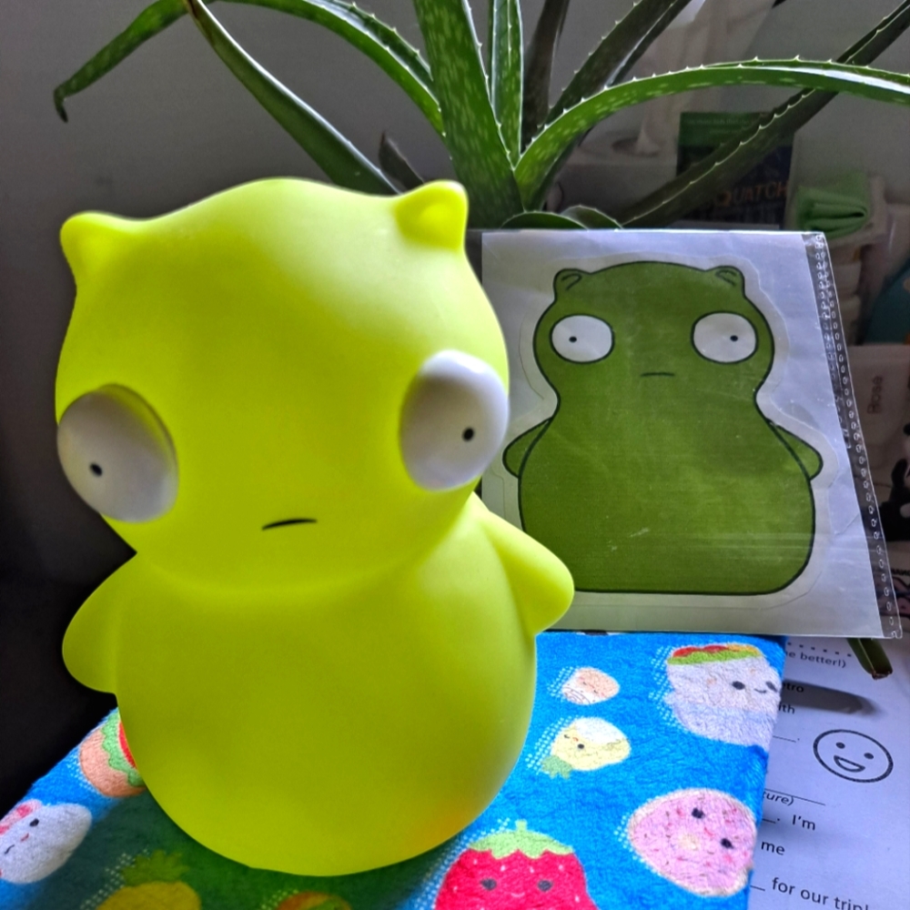 Bob's Burgers Kuchi Kopi Glow in the Dark Figurine & Sticker